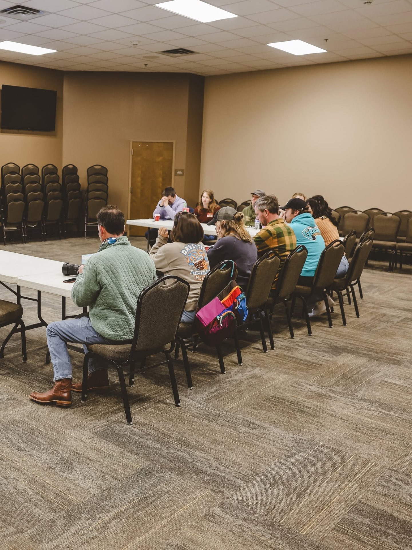 Couples around long tables during a Grace Marriage Saturday