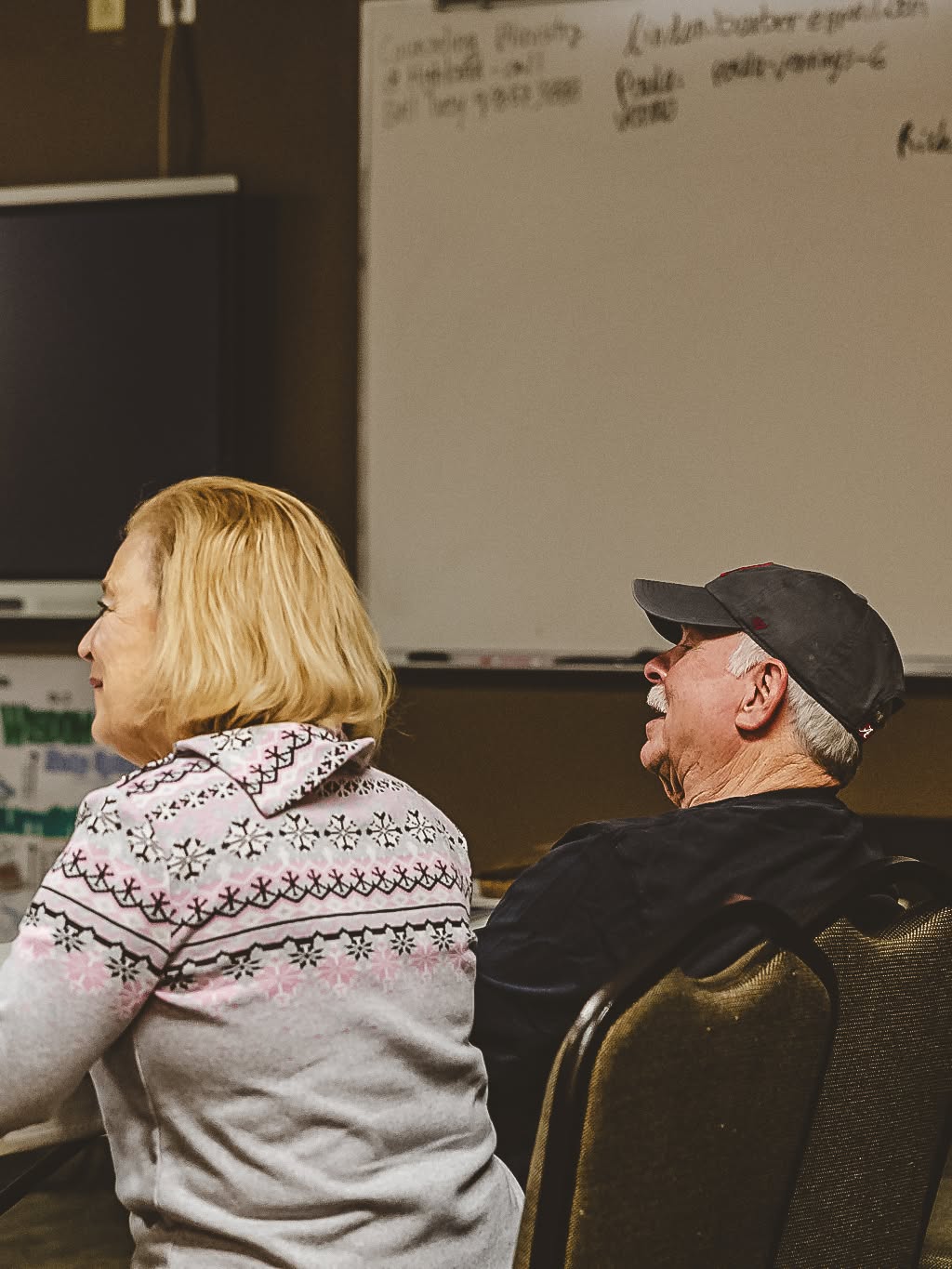 A couple sharing a laugh during a session